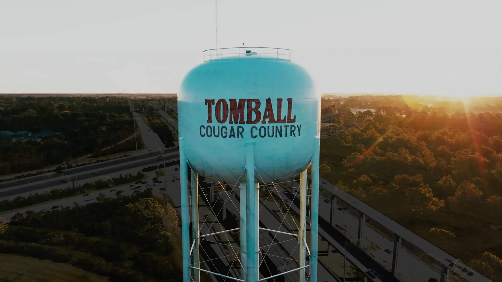 Tomball Cougar Country water tower at sunset
